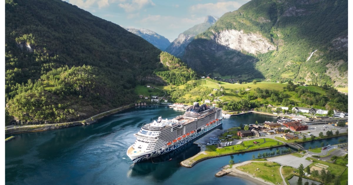 Steep Norwegian fjord and calm water for the Northern Stillness route